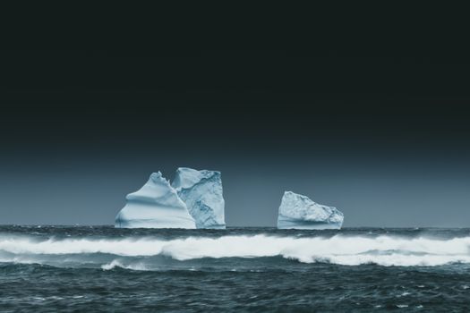 An iceberg with most of its mass hidden underwater, the classic metaphor for the hidden dark web beneath the surface web