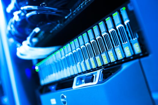 A blue-lit server rack representing the isolated virtual machines behind Whonix