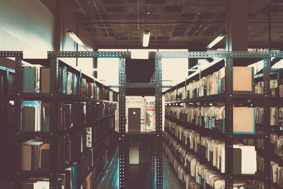 Rows of library shelves evoking the index-style directory of the Hidden Wiki