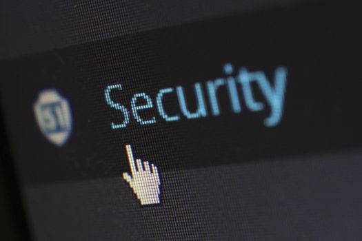 A cursor over digital security text, representing a dark web data-breach scan