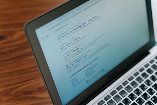 A laptop displaying a browser, illustrating installing and using the Tor Browser