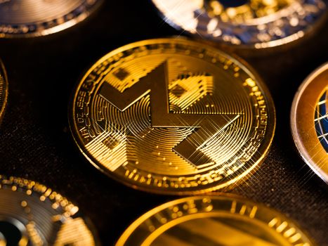 Gold Monero coin closeup focusing on digital currency privacy and blockchain forensics